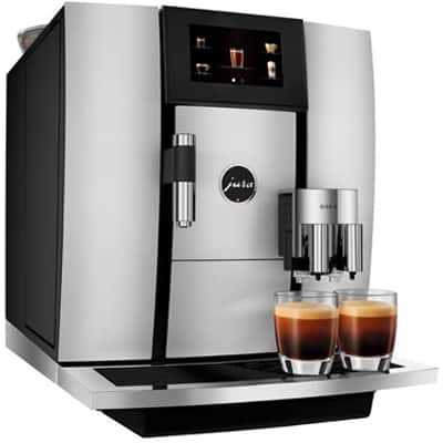 Jura Giga 6 automatic coffee machine with 2 coffee-filled glasses below its spouts