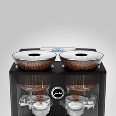 Ceramic grinding discs under the bean hoppers of the Jura Giga 6 espresso machine
