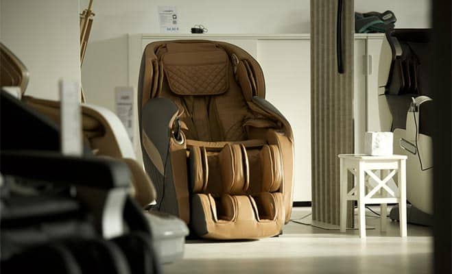A beige massage chair in a showroom