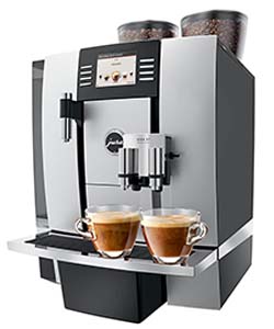 The Jura Giga X7 with full bean hoppers and 2 cups of coffee below its spouts