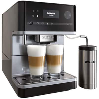 Miele CM6350 coffee machine with two glasses of latte macchiato on the drip tray
