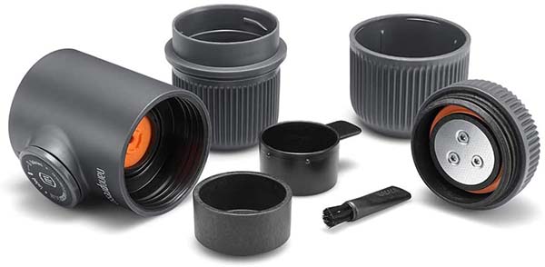 Wacaco Nanopresso Portable Espresso Maker accessories include a brush, filter basket, espresso cup, and scoop