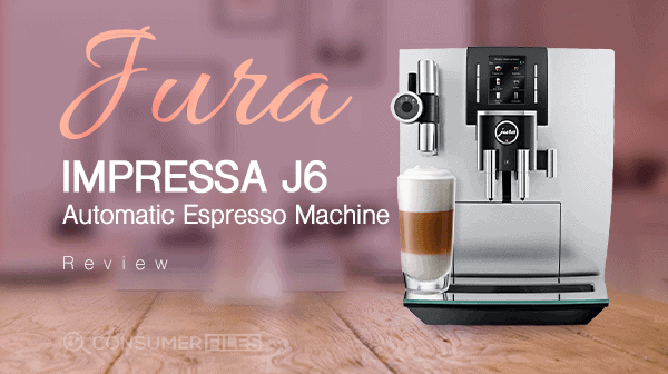 The Jura J6 Coffee Machine with a glass filled with specialty coffee under its milk spout