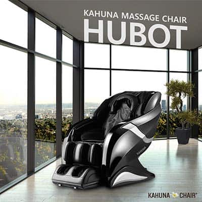 Kahuna Hubot HM-078 black variant in a room with large windows, gray tiled floor, and overlooking trees and buildings